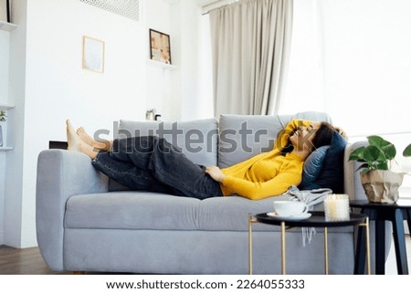 Similar – Image, Stock Photo Dreamy black woman lying on sofa with closed eyes