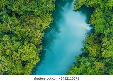 Serene River Tranquility: A Breathtaking Landscape with a Beautiful River, Charming Air, and Lush Trees Creating an Enchanting Scene of Nature's Beauty and Tranquility - Powered by Shutterstock