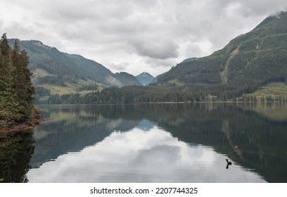 Serene Scene By The Mountain Lake In Canada