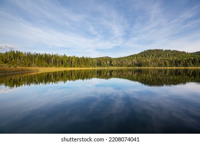 Serene Scene By The Mountain Lake In Canada