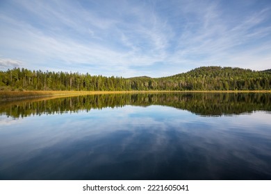 Serene scene by the mountain lake in Canada - Powered by Shutterstock