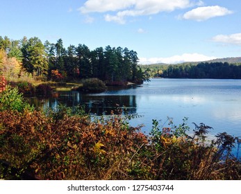 Serene Silver Lake And Fall Trees With Reflection Of The Blue Sky And Clouds In View, Madison, New Hampshire