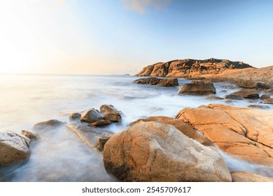 Serene Sunrise Over a Rocky Coastline, Shek O, Hong Kong - Powered by Shutterstock