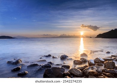 Serene Sunrise Over Rocky Seashore Landscape - Powered by Shutterstock