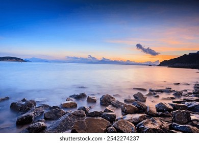 Serene Sunrise Over Rocky Seashore Landscape - Powered by Shutterstock