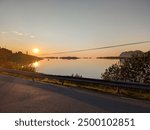 Serene Sunset by the Coastal Road