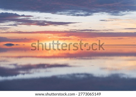 Serene sunset reflection over Salar de Uyuni bolivia salt flat