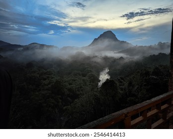 A serene and tranquil scene featuring a majestic mountain range, a meandering river, and a blanket of morning mist.
 - Powered by Shutterstock