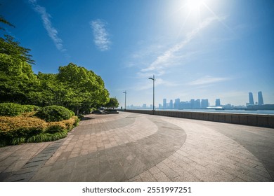 Serene Urban Pathway with Lush Greenery and City Skyline Views   - Powered by Shutterstock