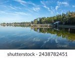 Serene view of Lake Livingston reservoir with nice coulds reflecting in  still waters in the East Texas Piney Woods in Polk County, Texas, United States