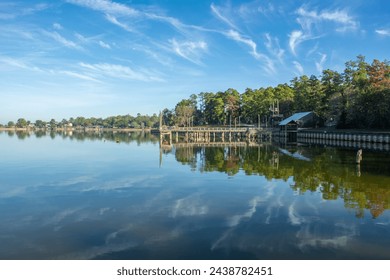 Serene view of Lake Livingston reservoir with nice coulds reflecting in  still waters in the East Texas Piney Woods in Polk County, Texas, United States - Powered by Shutterstock