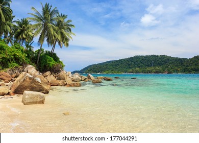 Serene view on the tropical sandy beach with coconut palms, Perhentian Kecil Island, Malaysia 
