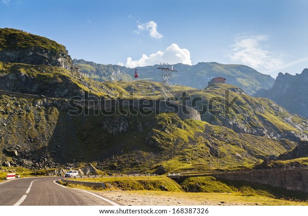 Serene\
view of Transfagarasan highway with cable car access to Balea Lake\
resort. It is the second highest road in Romania climbing up to\
2,034 m altitude in Fagaras Mountains,\
Romania.