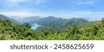 Serene Vista of Tai Tam Reservoir Amidst Lush Greenery, Hong Kong Island Trail