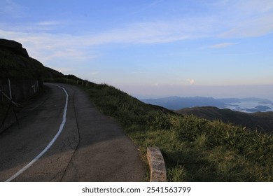 Serene Winding Road with Panoramic Ocean View - Powered by Shutterstock