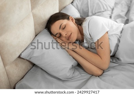 Similar – Image, Stock Photo Young woman sleeping on comfortable sofa with cushion at home