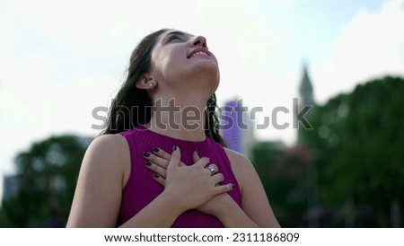 Similar – Image, Stock Photo Young woman gazing upwards in urban setting
