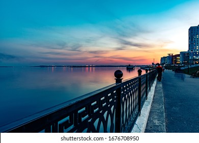 serenity Holiday vacation travel concept - Spring night city embankment quay coastline under sunset - Powered by Shutterstock