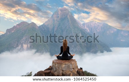 Serenity and yoga practicing at mountain range,meditation 