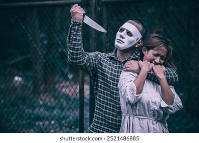 A serial killer scene is about to kill an Asian woman,concept thriller scene,Halloween festival