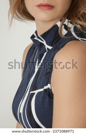 Serie of studio photos of young female model in viscose printed bodycon sleeveless turtleneck dress. Classic and simple summer fashion. 