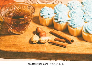 Series of Blue Frosted Cupcakes arranged with nuts, tea and spices - Powered by Shutterstock