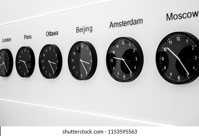 A series of clocks showing the time in different parts of the world. Business, travel, time concept.