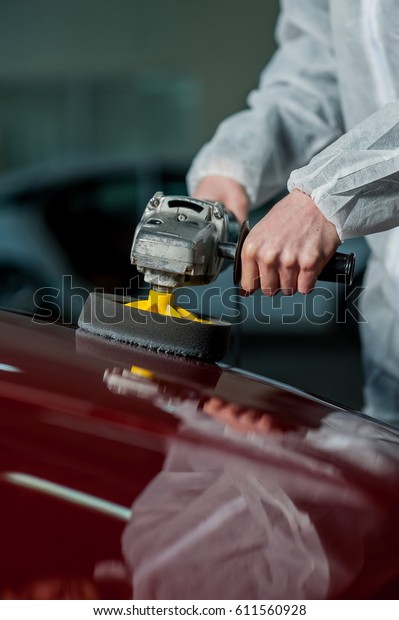 A series of\
detailed cars: Polishing a\
car