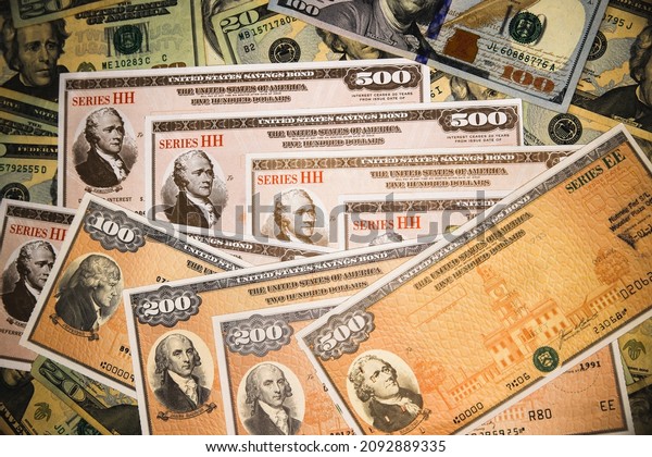 Series HH and Series EE\
United States Treasury Savings Bonds surrounded by US currency. \
Issued by the US Government and  purchased from the U.S. Department\
of the Treasury.