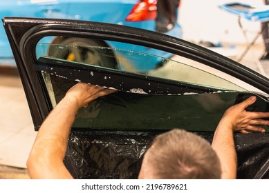 A Series Of Tinting Car Windows. Installation Of Tinting Film On The Car Glass. Specialist In The Installation Of Tinting Film In The Process Of Work.