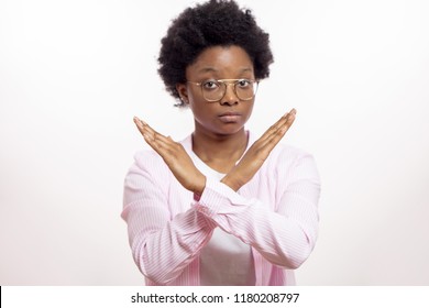 serios mixed race woman says no isolated on white background. severe afro female with crossing arms expressing her negative attitude to smoking - Shutterstock ID 1180208797