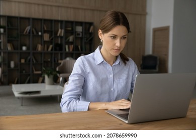 Serious 35s Woman Working On Computer Sit At Table In Cozy Living Room. Freelance Job, Remote Communication, Solve Business, E-mailing To Client Distantly, Web Surfing Information, Connection Concept