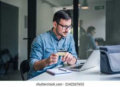 Serious Adult Man, Checking His Bank Insurance Policy, Online.