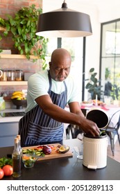 Serious African American Senior Man Cooking In Kitchen. Retirement Lifestyle, Leisure And Spending Time At Home.