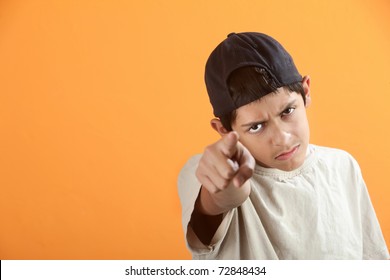 Serious Or Angry Latino Kid Points Index Finger