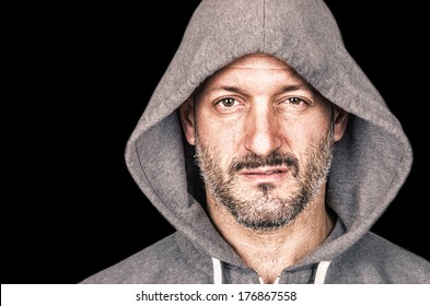 Serious angry man with hooded sweatshirt