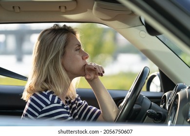 Serious anxious female driving car. Adult woman of middle age pensive sad thinking on important decision while waiting in traffic jam. Depressed or worried vehicle driver in automobile feeling bad - Shutterstock ID 2056750607
