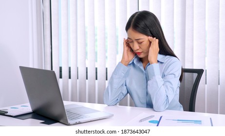 Serious Asian Business Woman Strong Headache Because Working Hard And Stress From Hard Work In Office