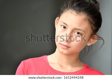 A Serious Asian  Teenager Girl