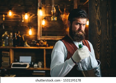 Serious Barman. Restaurant Staff. Bearded Hipster Wear Waistcoat. Pub Retro Vintage Interior. Barman With Beard. Hipster Barman Concept. Bearded Waiter Or Servant. Vintage Pub. Swag Guy With Alcohol