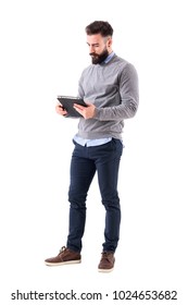 Serious Bearded Businessman Or Teacher Reading Notebook Paper. Full Body Length Portrait Isolated On White Studio Background.