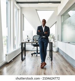 Serious Black Male Businessman With Crossed Arms Looking At Camera In Office. Adult Company Boss Wearing Formal Wear. Concept Of Modern Successful Man. Idea Of Business Leadership And Management