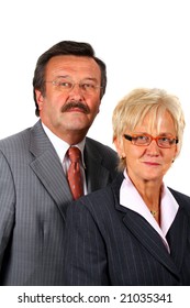 Serious Business Team A Senior Business Couple In Suits In Their 50s And 60s. Isolated Over White.