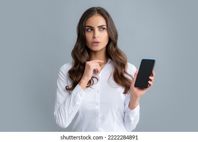 Serious Business Woman Looking At The Phone Screen, Reading Message On Smartphone, Typing Text On Smart Mobile Phone. Female Freelancer Chatting By Mobile Phone.