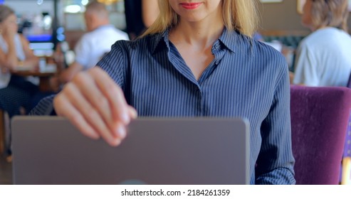 Serious Business Woman Is Opening Laptop For Working In Restaurant 