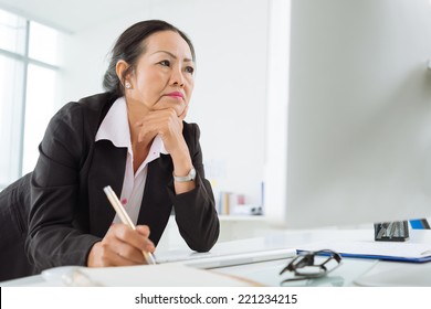 Serious Business Woman Reading Information On The Screen