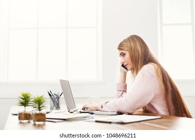 Serious Business Woman At Work Talking On Phone, Sitting At Her Working Place In Office, Copy Space, Side View