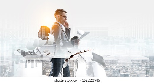 Serious Businessman With Glasses, Making A Phone Call And Looking At Documents