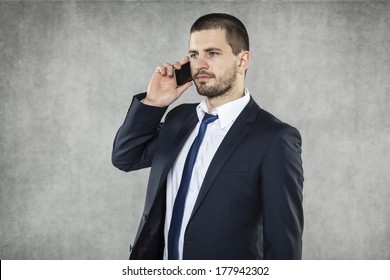 Serious Businessman Talking On The Phone