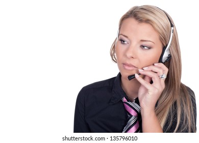 Serious Call Center Agent Holding Her Mouthpiece While Looking At Something